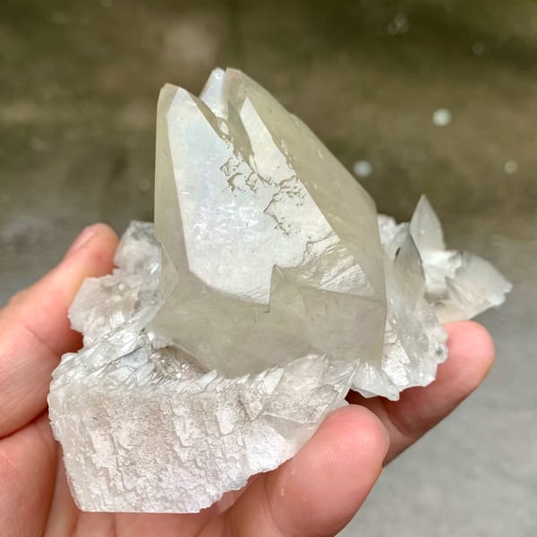 Large twinned calcite crystal with sketch-pattern lines from Hubei, China, close-up of the crystal faces
