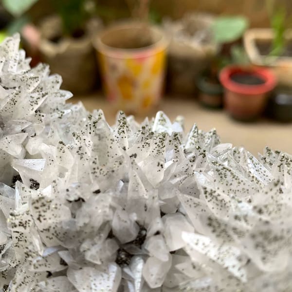 Long plate of sharp-pointed calcite crystals with pyrite from Hubei, China, reverse side