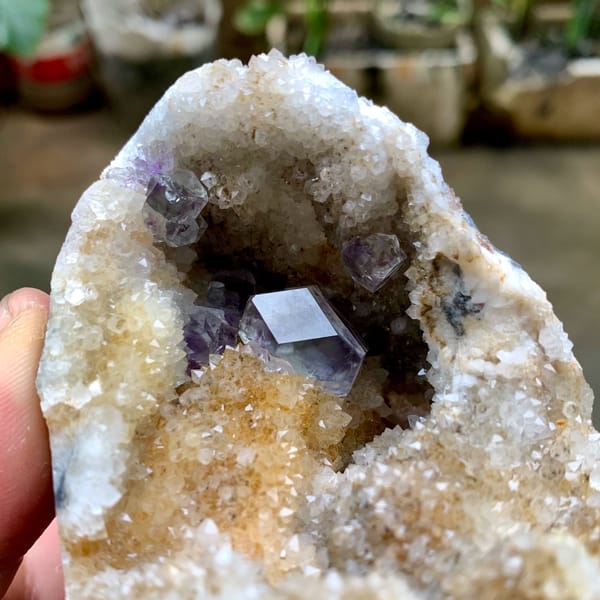 Quartz geode with purple fluorite crystal inside from Fujian, China, second angle