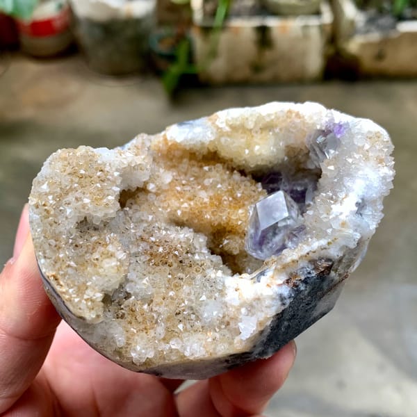 Quartz geode with purple fluorite crystal inside from Fujian, China, reverse side