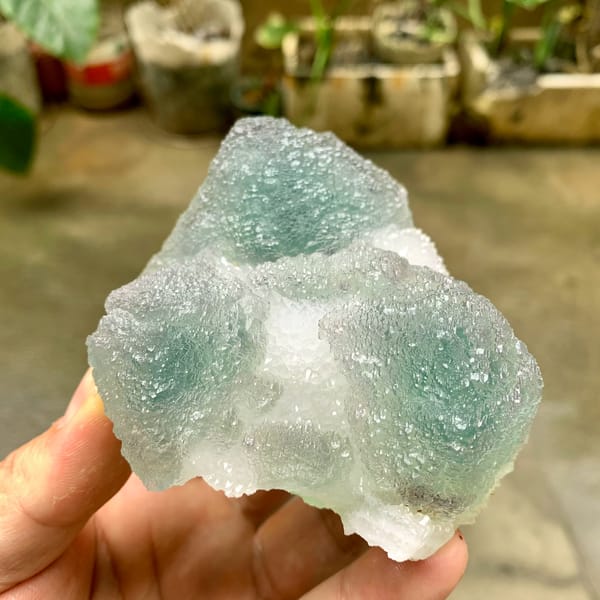 Large stepped green fluorite mounds with sugary skin from Fujian, China, close-up of the crystal faces