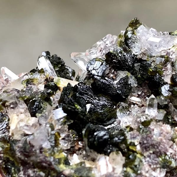 Dark green epidote blades with lilac quartz from Yunnan, China, top view