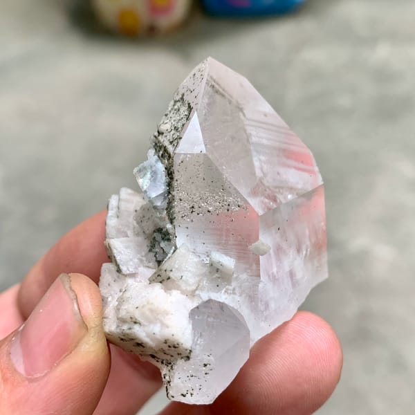 Clear quartz prism with fluorite cube and chlorite on dolomite from Yaogangxian Mine, Hunan, China, second angle