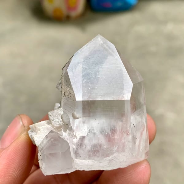 Clear quartz prism with fluorite cube and chlorite on dolomite from Yaogangxian Mine, Hunan, China, top view
