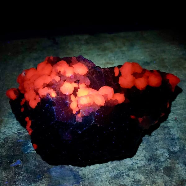 Dark garnet crystals with white calcite balls from Inner Mongolia, China, second angle