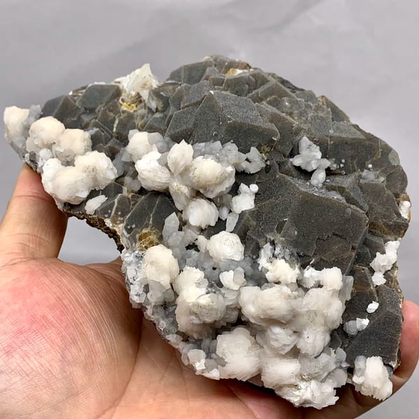 Dark garnet crystals with white calcite balls from Inner Mongolia, China, reverse side