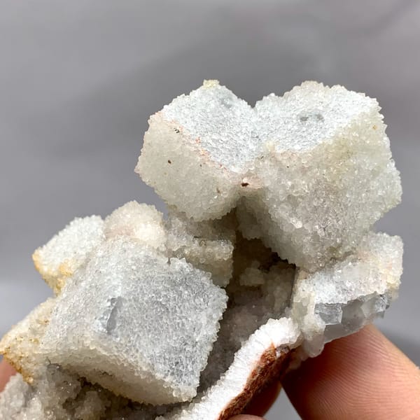 White sugar-frosted fluorite cubes on quartz from Fujian, China, second angle