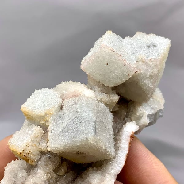 White sugar-frosted fluorite cubes on quartz from Fujian, China, reverse side