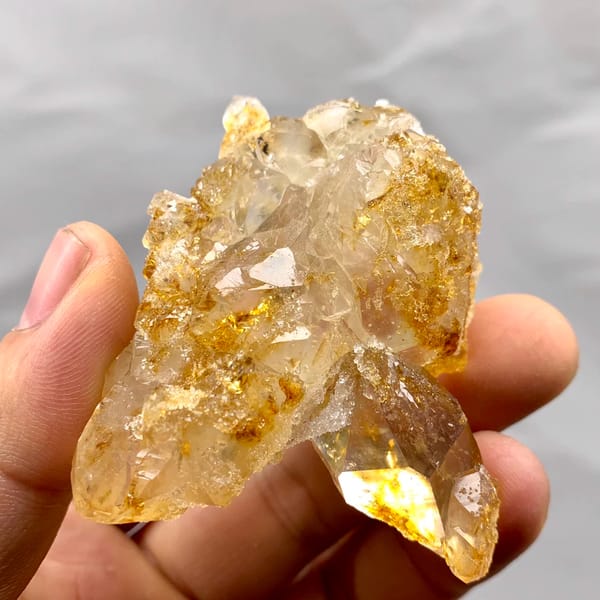 Golden natural citrine quartz floater from Guangdong, China, reverse side