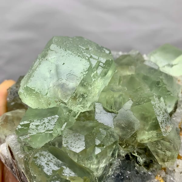 Cluster of large glassy sea-green fluorite cubes from Fujian, China, reverse side