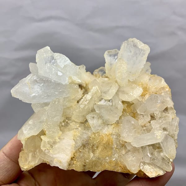 Serrated translucent baryte blades on golden matrix from Jinkouhe, Sichuan, China, detail of the matrix contact