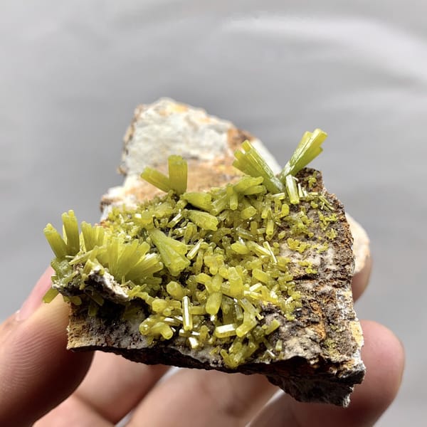 Matcha-green pyromorphite prisms on brown matrix from Guangxi, China, detail of the matrix contact