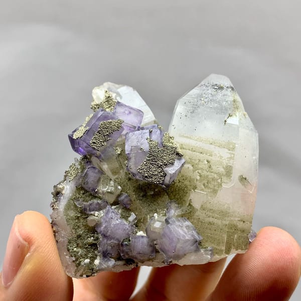 Purple fluorite cubes with pyrite on clear quartz from Yaogangxian Mine, Hunan, China