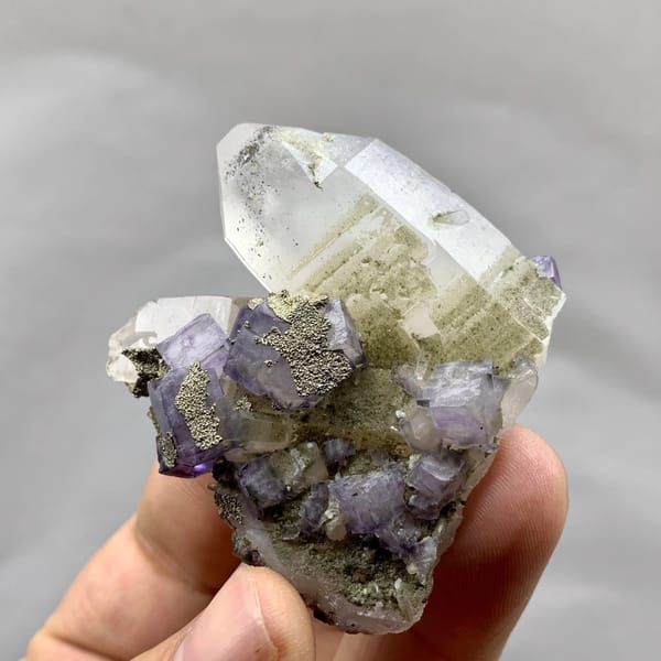 Purple fluorite cubes with pyrite on clear quartz from Yaogangxian Mine, Hunan, China, reverse side