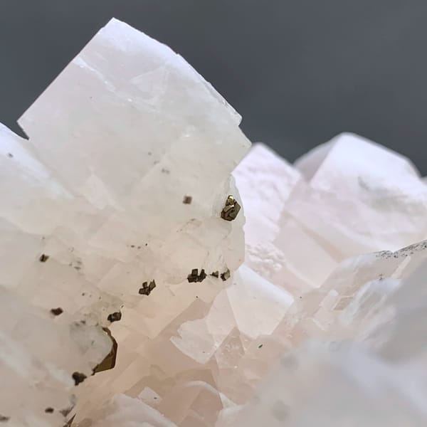 Soft pink calcite crystals with pyrite from Fujian, China, reverse side