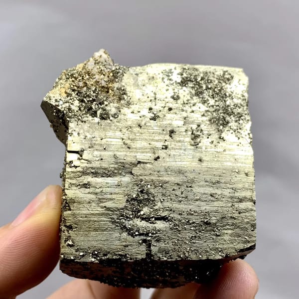 Heavy brass-gold pyrite block with striated faces from Yaogangxian Mine, Hunan, China, second angle