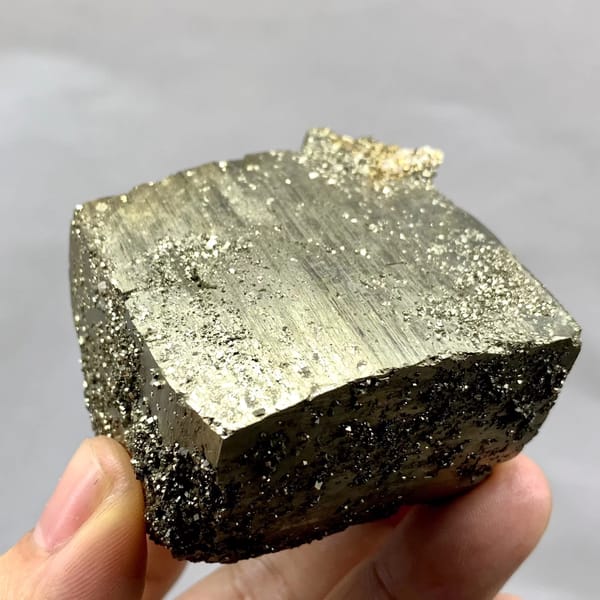 Heavy brass-gold pyrite block with striated faces from Yaogangxian Mine, Hunan, China, reverse side