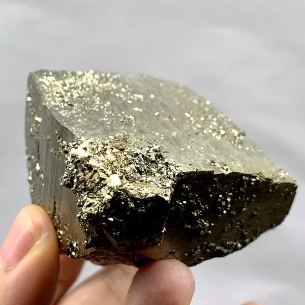 Heavy brass-gold pyrite block with striated faces from Yaogangxian Mine, Hunan, China, top view