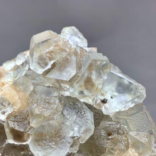 Etched white fluorite octahedra with calcite from Inner Mongolia, China, reverse side