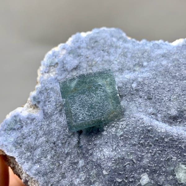 Teal fluorite cube on dusty lavender recrystallised fluorite from Inner Mongolia, China, second angle
