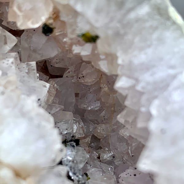 Pale lilac quartz geode with green epidote from Sichuan, China, top view