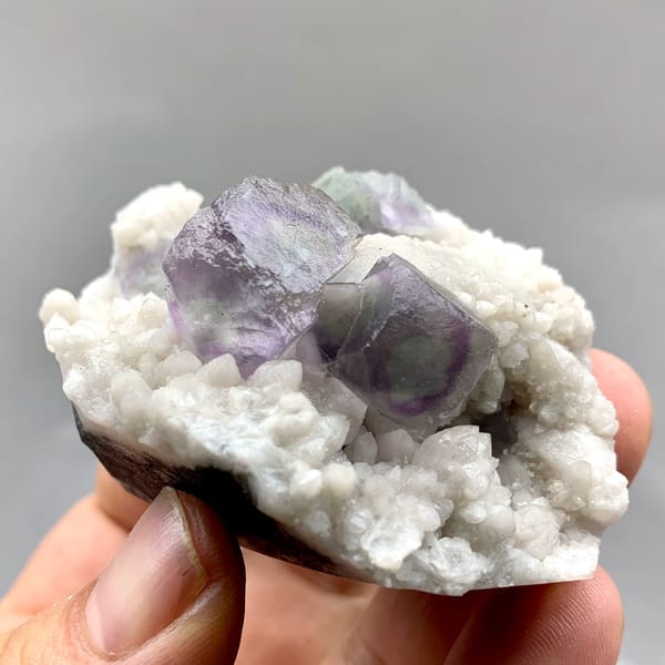 Purple-edged green fluorite cubes in white quartz from Inner Mongolia, China, top view