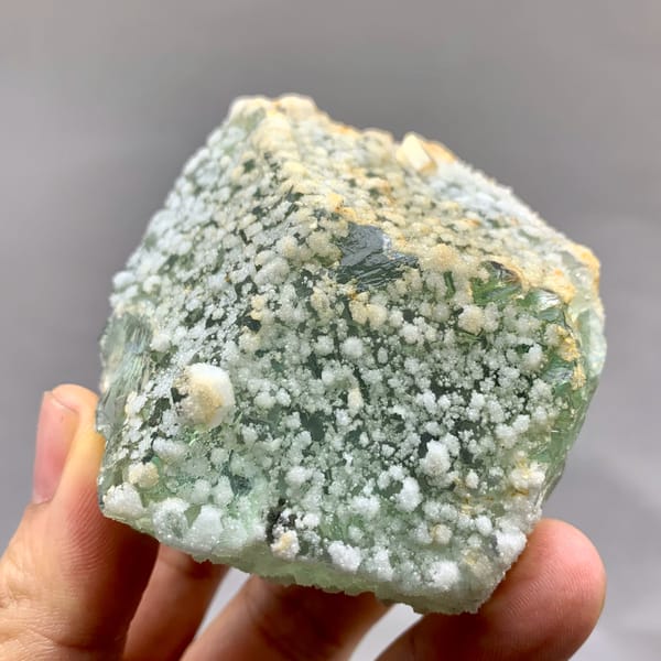 Green sugar-textured fluorite block with white calcite dots from Fujian, China, second angle