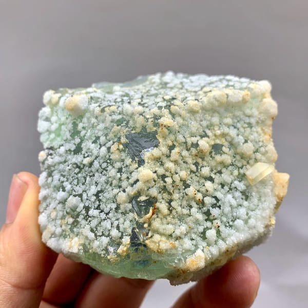 Green sugar-textured fluorite block with white calcite dots from Fujian, China, reverse side