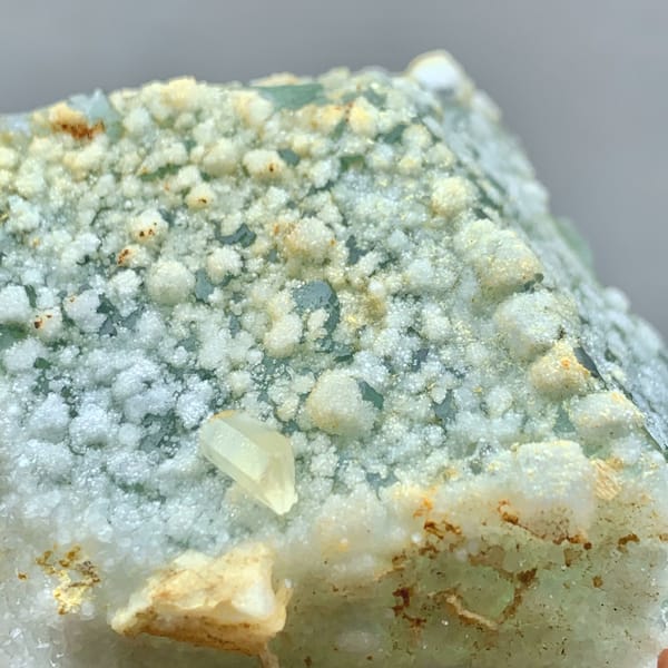 Green sugar-textured fluorite block with white calcite dots from Fujian, China, top view