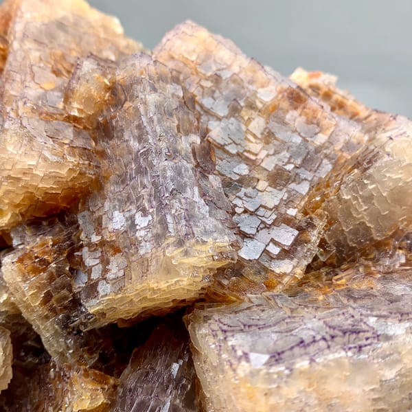 Large block of purple and yellow QR-code patterned fluorite cubes from Guizhou, China, second angle