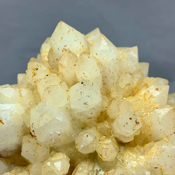 Large yellow pineapple-textured quartz cluster from Fujian, China, close-up of the crystal faces