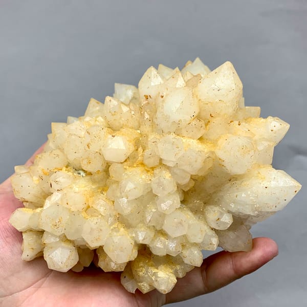 Large yellow pineapple-textured quartz cluster from Fujian, China, reverse side