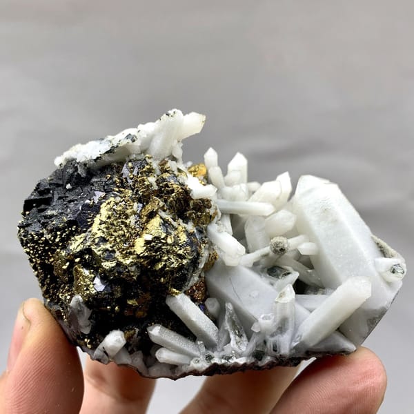 Golden chalcopyrite and black marmatite with white quartz from Inner Mongolia, China, detail of the matrix contact