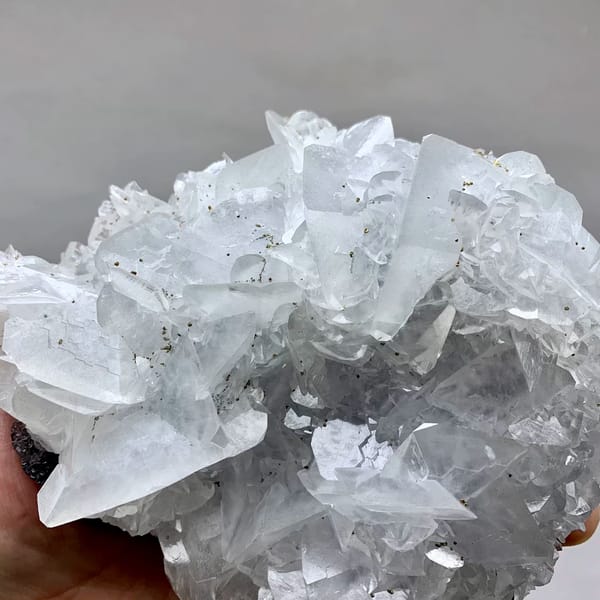 Large plate of glassy calcite blades with pyrite from Xianghualing, Hunan, China, reverse side