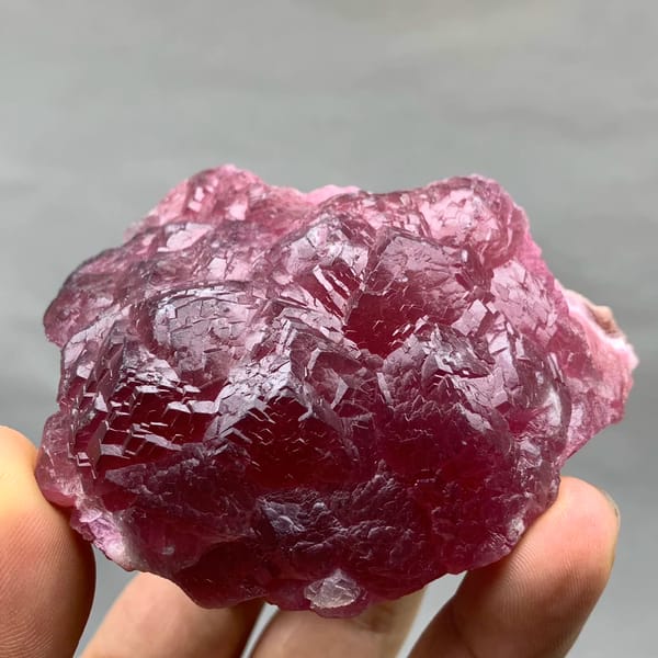 Raspberry-red cobaltoan calcite crust from Morocco, close-up of the crystal faces