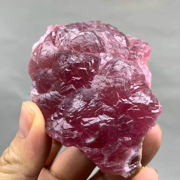 Raspberry-red cobaltoan calcite crust from Morocco, reverse side
