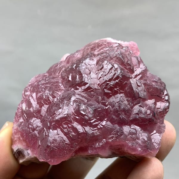 Raspberry-red cobaltoan calcite crust from Morocco, detail of the matrix contact