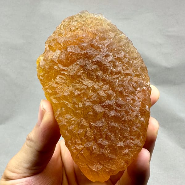 Amber-yellow translucent fluorite block from Zhejiang, China, reverse side