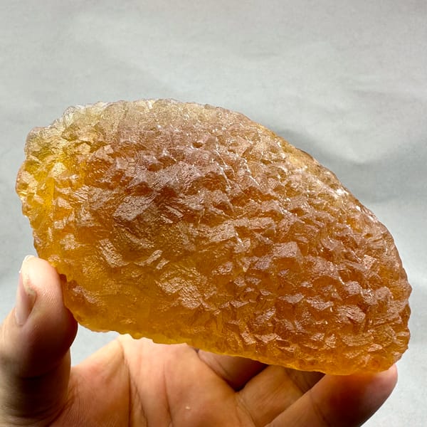 Amber-yellow translucent fluorite block from Zhejiang, China, top view