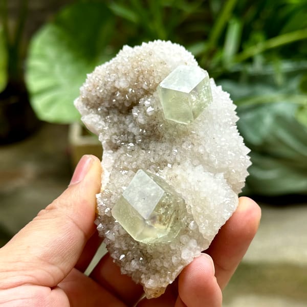 Two transparent green dodecahedral fluorite crystals on white quartz from Fujian, China, second angle