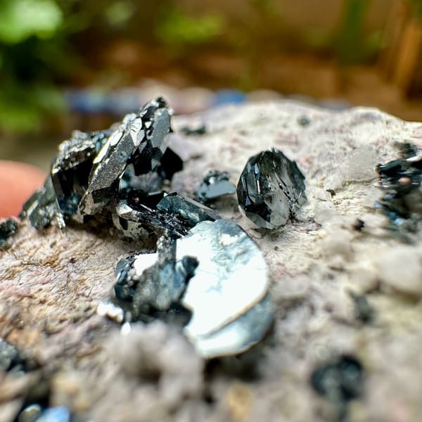 Black hematite rosettes on grey rock from Sichuan, China, second angle