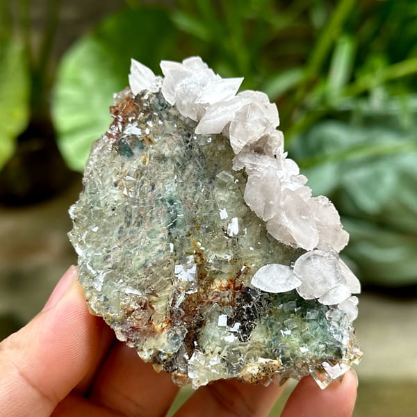 Glassy green fluorite cubes with white calcite and pyrolusite from Xianghualing, Hunan, China, top view