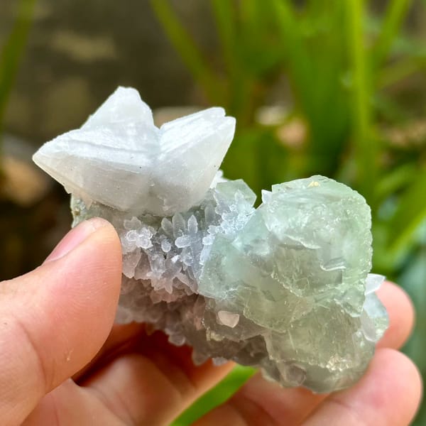 Glassy green fluorite over quartz with white calcite from Fujian, China, reverse side