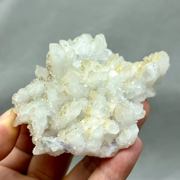 Yellow-skinned quartz cluster with purple fluorite from Fujian, China, reverse side
