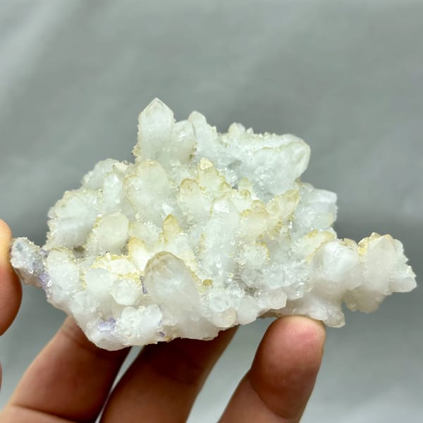 Yellow-skinned quartz cluster with purple fluorite from Fujian, China, top view
