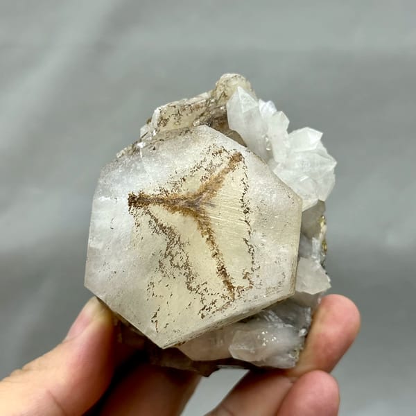 Large hexagonal calcite crystal with star-shaped growth pattern from Fujian, China, close-up of the crystal faces
