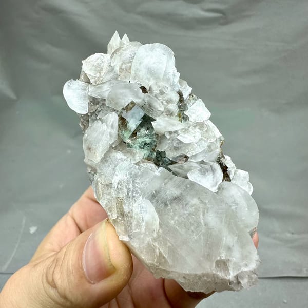 White calcite blades over glassy green fluorite from Xianghualing, Hunan, China, top view
