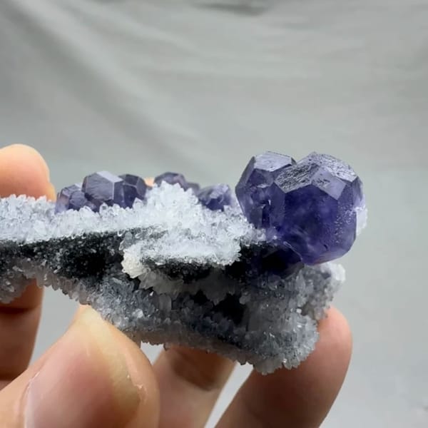 Violet-blue fluorite cubes on sparkling grey quartz from Fujian, China, second angle