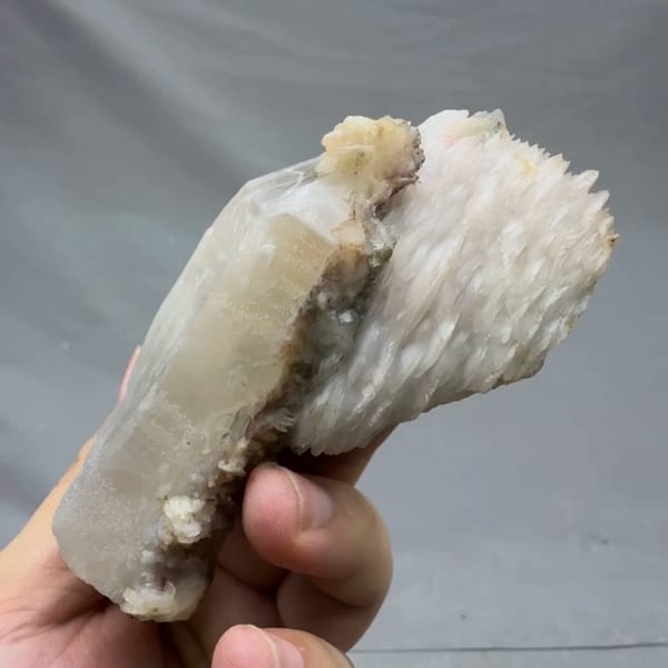 Pale quartz prism topped with layered white calcite from Inner Mongolia, China, top view