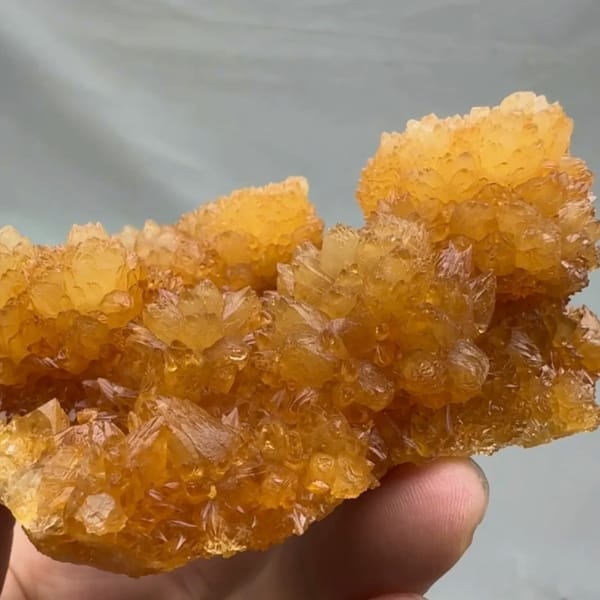 Golden-yellow botryoidal calcite balls from Guizhou, China, top view